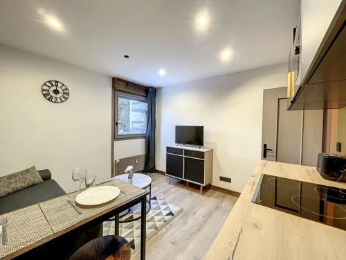 a living room with a couch and a table at Centre village station ski in Saint-Gervais-les-Bains