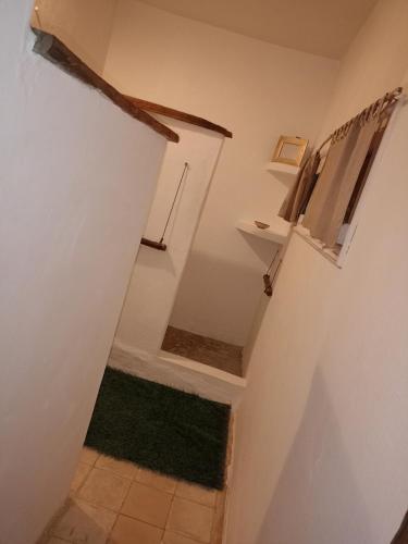 a stairway with a green rug in a room at Riad Sahara Sunset Beach Douira in Agadir