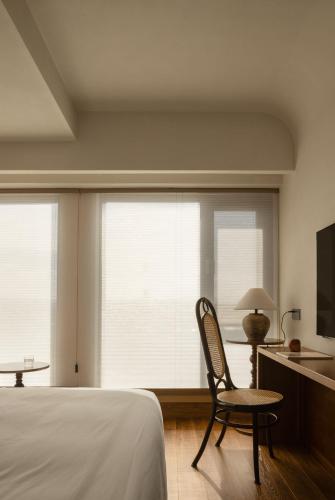 Postel nebo postele na pokoji v ubytování 昆明市呈贡区椿屿岚酒店 Chun Yulan Hotel