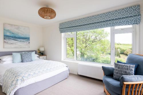 Ένα ή περισσότερα κρεβάτια σε δωμάτιο στο Blue Haze