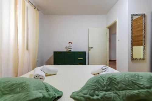 Кровать или кровати в номере Pretty apartment in the centre - Old Town Zadar