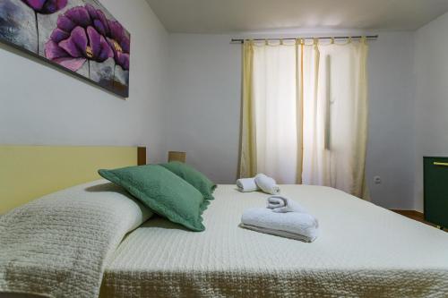 Кровать или кровати в номере Pretty apartment in the centre - Old Town Zadar