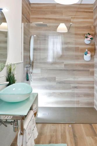 a bathroom with a sink and a shower at Valentine's Home in Viareggio