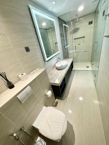 a bathroom with a toilet and a sink and a shower at Star Residence Suite KLCC in Kuala Lumpur