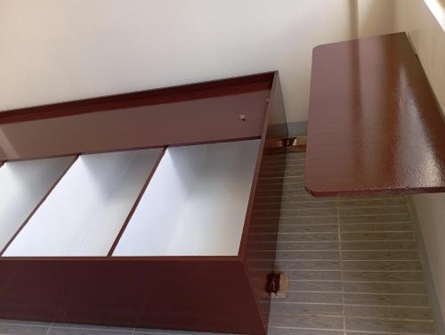 a stair case with glass doors and a brown railing at Casa Verde in Burgos