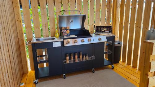 a play kitchen with a stove and a sink at Ahoi Hause 17 in Drage
