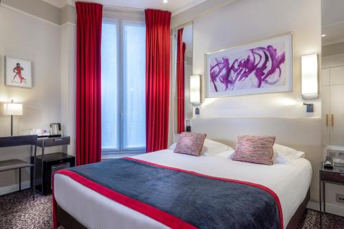 a hotel room with a large bed with red curtains at Hôtel Du Bois Champs-Elysées in Paris