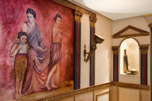 a large painting on the wall in a room at Le Temple Des Arts in Ouarzazate