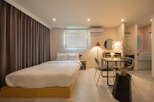 Postel nebo postele na pokoji v ubytování Object AanK Hotel Gumi