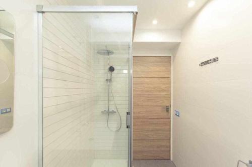 a shower with a glass door in a bathroom at GuardaViñas24 in Logroño