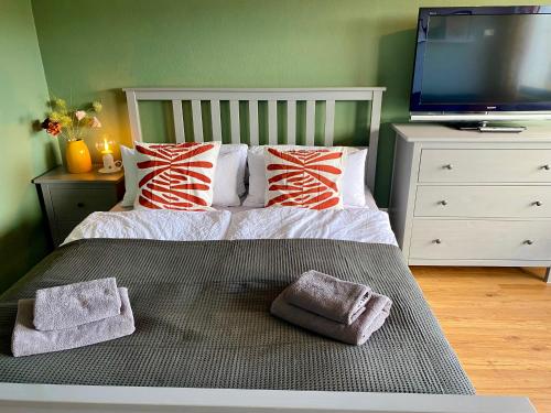 Postel nebo postele na pokoji v ubytování Ferienwohnung Strandhafer