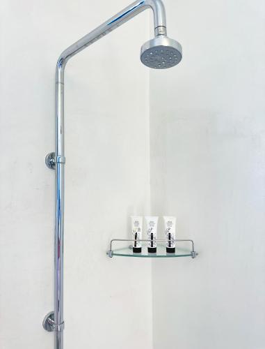a shower with a glass shelf in a bathroom at Dar Fen Luxery House in Houmt Souk