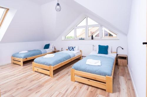 En eller flere senge i et værelse på Golf & Lake House 14