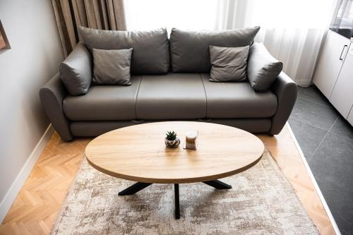 a living room with a couch and a coffee table at Bitola Apartments in Bitola
