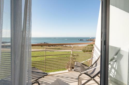 a balcony with a view of the ocean at Sofitel Quiberon Thalassa sea & spa in Quiberon