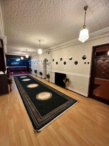 a large room with a black rug on the floor at NIGRUM HOTEL in Nevsehir