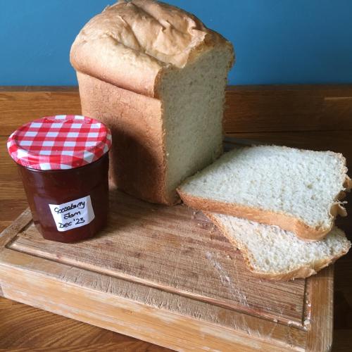 a loaf of bread and a container of peanut butter and a sandwich at Treganoon House, Lanlivery in Bodmin