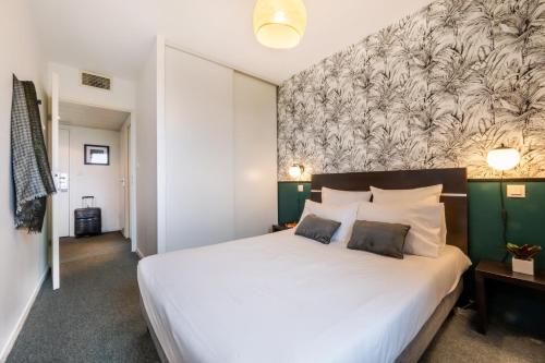 Postel nebo postele na pokoji v ubytování Nemea Appart Hotel Toulouse Aéroport