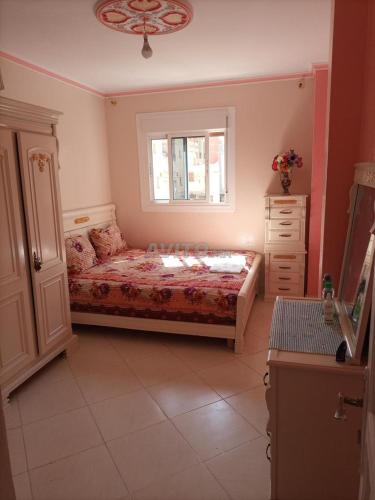 Katil atau katil-katil dalam bilik di appartement luxe au centre ville