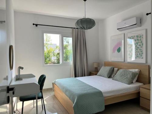 Ένα ή περισσότερα κρεβάτια σε δωμάτιο στο Margarita Gardens two 1bed flats 500m from sea