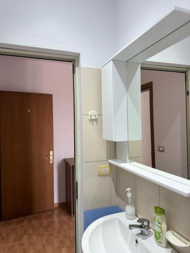 a bathroom with a sink and a mirror at GuestHouse Cami in Durrës