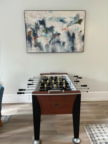 a chess table in a room with a painting at CONSHOHOCKEN: Quality & Location in Conshohocken