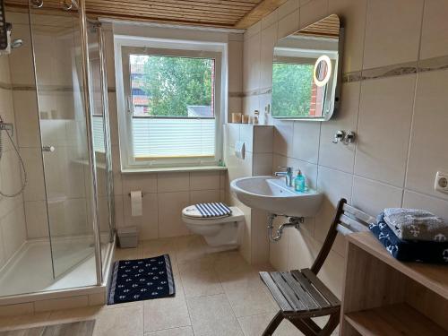 a bathroom with a shower and a toilet and a sink at Ankerplatz Barth in Barth