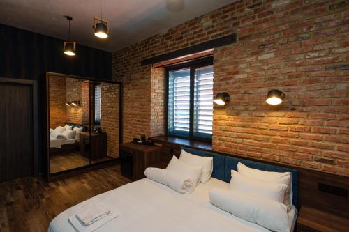 Postel nebo postele na pokoji v ubytování Palmira Hotel
