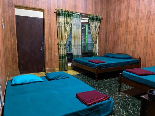 Postel nebo postele na pokoji v ubytování Parikesit Guest House
