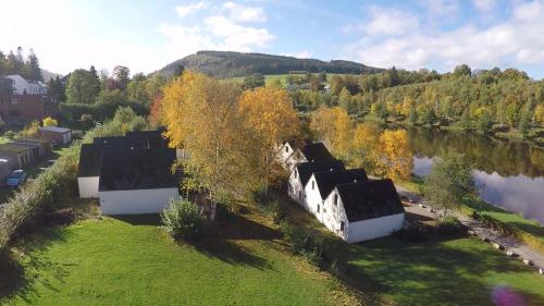 an aerial view of a house next to a lake at Maison du Lac 4 in Vielsalm