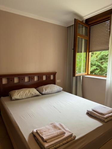 a bedroom with a bed with two towels on it at Santa Marina Apartment 513 in Sozopol