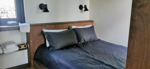 Postel nebo postele na pokoji v ubytování Minimaisons de Val-Jalbert