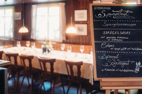 a long table with a sign in front of it at Hofgut Himmelreich in Kirchzarten