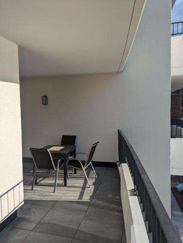a balcony with a table and chairs on it at Ferienwohnungen Heimkino Cochem in Cochem