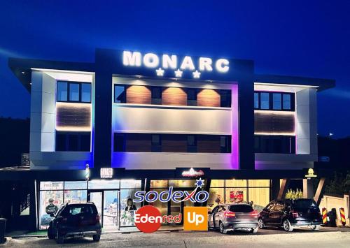 a store with cars parked in front of it at MONARC Boutique ApartHotel - SELF CHECK-IN in Iaşi