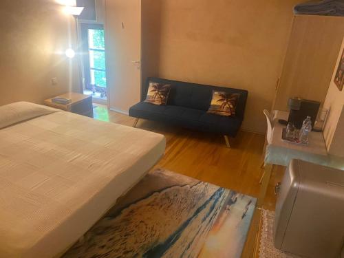 a living room with a bed and a couch at Aitzkorri Zegama in Arrietas