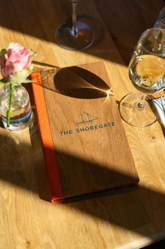 a book sitting on top of a wooden table at The Shoregate in Crail