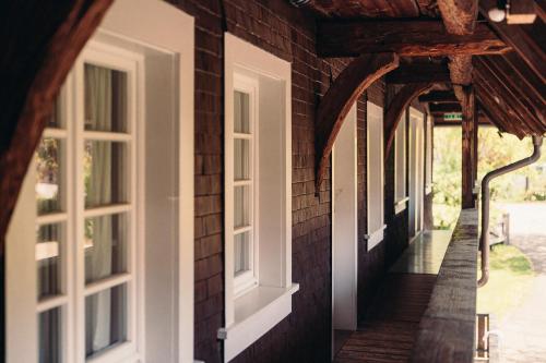 a hallway of a house with white windows at Hofgut Himmelreich in Kirchzarten