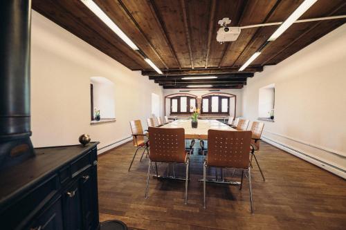 a dining room with a table and chairs at Hofgut Himmelreich in Kirchzarten