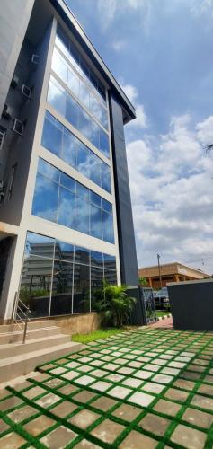 a large building with a lot of windows at The Palms Hotel in Abuja