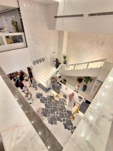 an overhead view of a lobby with people in a building at فندق مادن طيبة MADEN Taiba HOTEL in Al Madinah