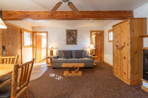 a living room with a couch and a table at Red Wolf Lakeside Lodge in Tahoe Vista