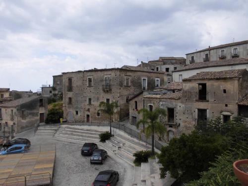 a group of buildings with cars parked in a parking lot at CasaMare Luxury Siderno in Siderno Marina