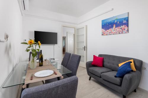 a living room with a couch and a table at Nada apartment in Rijeka