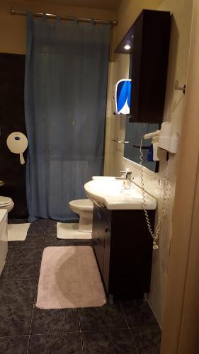 a bathroom with a sink and a toilet and a shower at B&B Bed& Fly - Mamma Mia in Azzano San Paolo