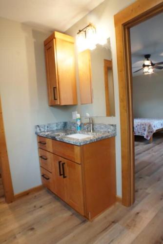 a bathroom with a sink and a mirror at Fieldstone Manor in Frankfort