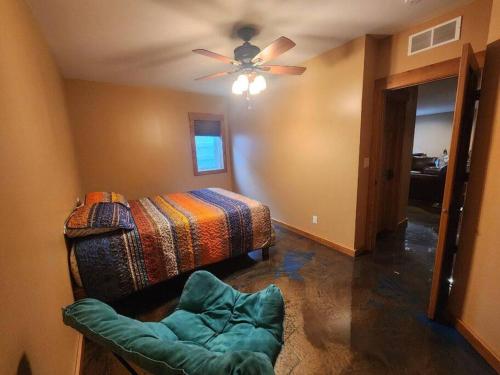 a bedroom with a bed and a ceiling fan at Fieldstone Manor in Frankfort