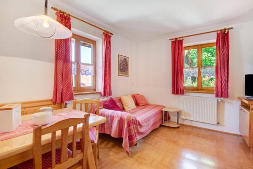 a living room with a couch and a table at Ferienhof Schütz in Eschlkam