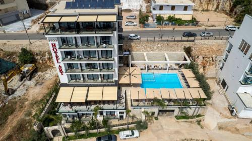 an aerial view of a building with a pool at Art Hotel in Sarandë