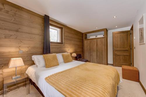 Ένα ή περισσότερα κρεβάτια σε δωμάτιο στο Chalet les Sauberands
